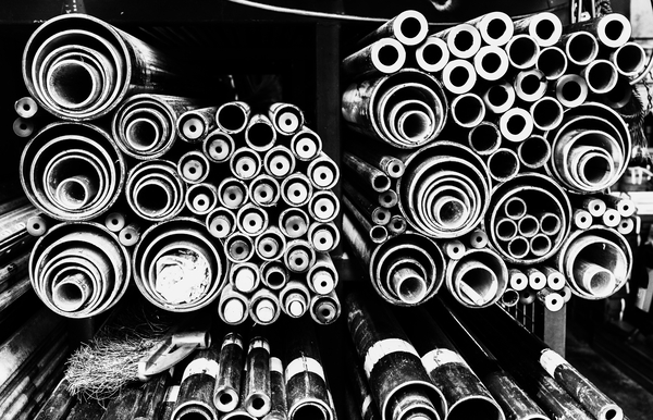 A grayscale steel pipes background